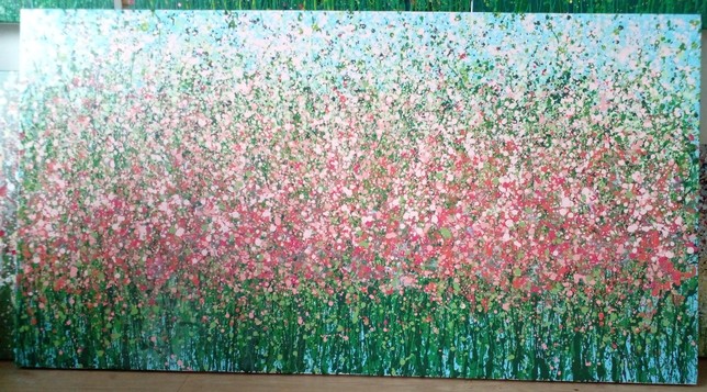 an abstract field of pink flowers done with splatters and drips of paint, it is wide horizontally