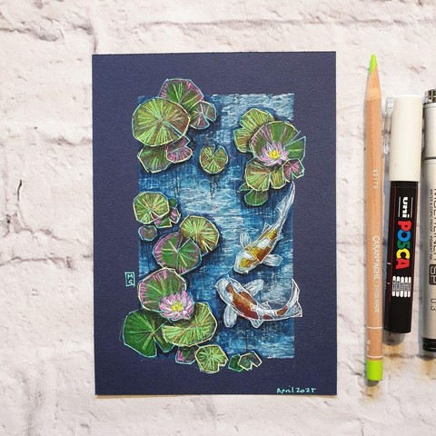 A small drawing of a top down view of two koi fish and waterlilies in a pond. The drawing is on Dark blue Pastel paper.
Koi fish were brought to the worlds attention after one was given to the Japanese emperor as a gift in 1914 to grace the imperial palaces mote.
An original art work
Colour pencil and mixed media on acid free toned artist paper
5 by 7 inches (12.7 by 17.8 cm).
Sold unframed