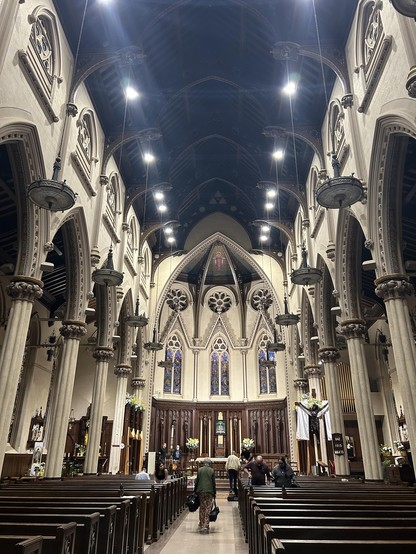 Interior of a Gothic Revival church looking towards the altar.