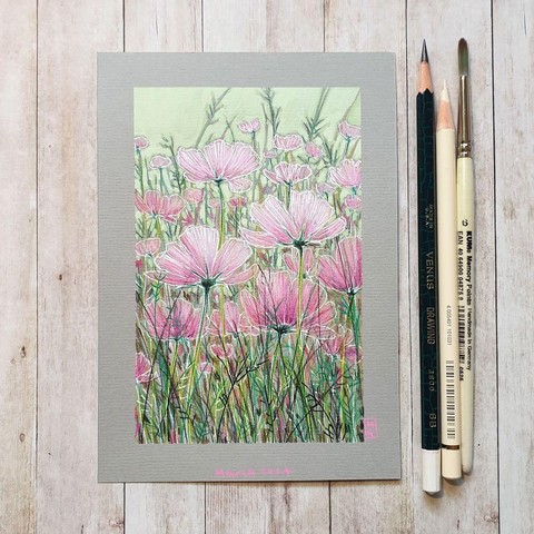 A drawing of a flowerbed filled with pink cosmos on grey pastel paper. The palette for this artwork is mostly green and pink, soft, pale colours with low contrast.
An original art work
Colour pencil and mixed media on acid free toned artist paper
5 by 7 inches (12.7 by 17.8 cm). This is a standard photo size in the UK and USA and should be easy to DIY frame.
Sold unframed