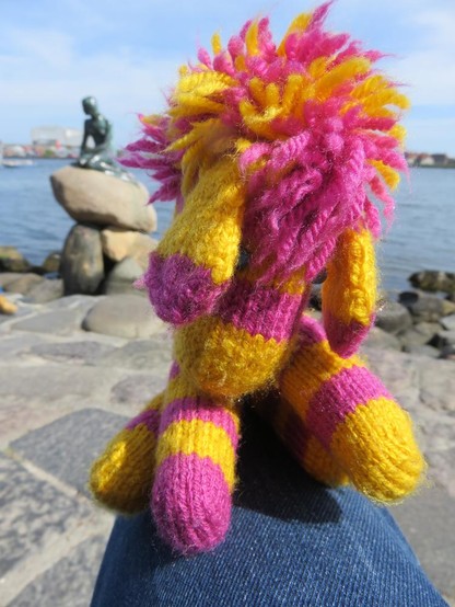 Knitted zebra plushie in front of Little Mermaid