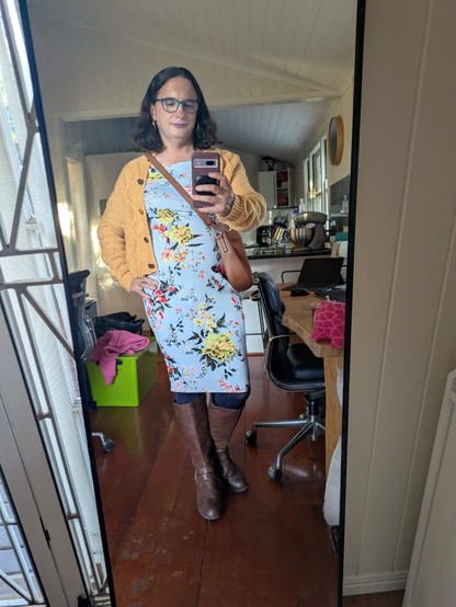 Mirror selfie of me wearing the outfit in the flat lay.