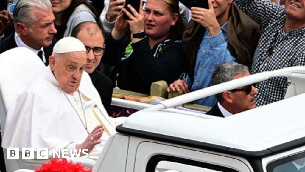 Pope Francis waves to crowds the day before his death